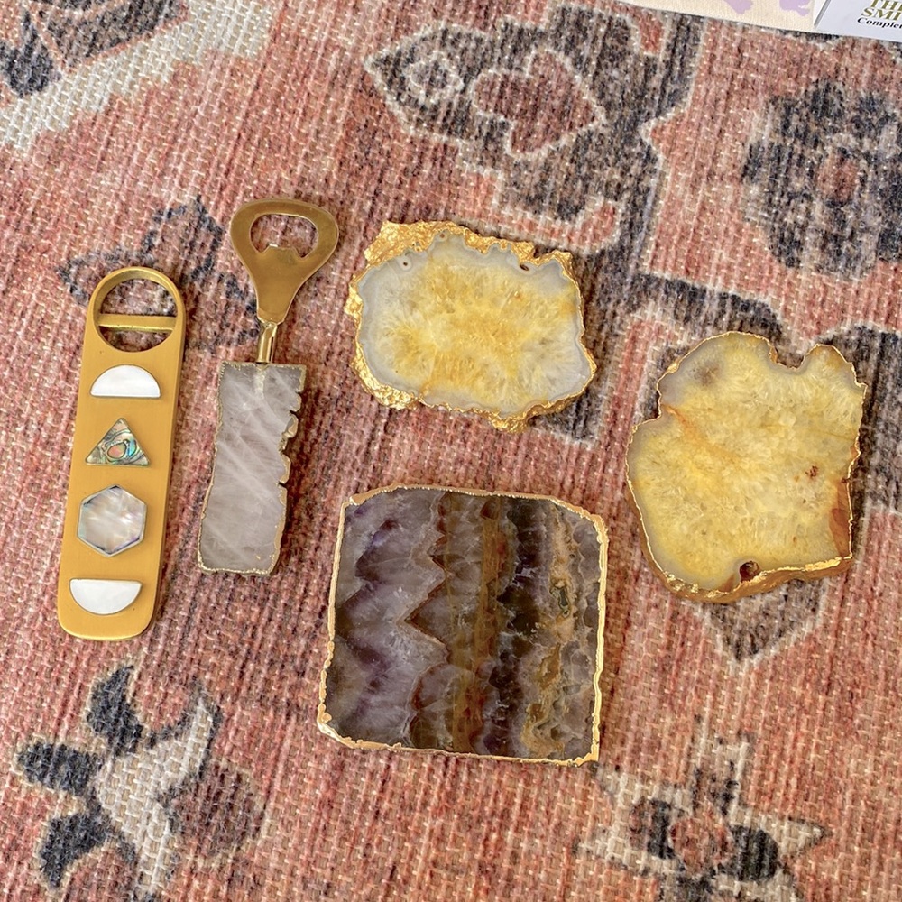 Two bottle openers and 3 crystal coasters